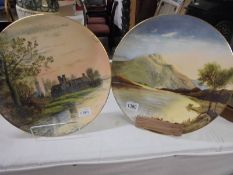 36cm diameter wall plaque of an old building by a lake with trees. Signed my M.W.K. Blair,
