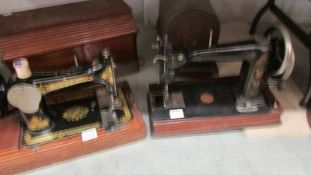 A vintage Singer sewing machine and one other. COLLECT ONLY.