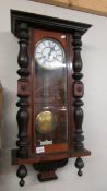 A Victorian mahogany Vienna wall clock, in working order, COLLECT ONLY.