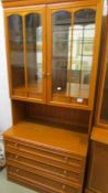 A good quality display cabinet with two glazed doors and three drawers, in as new condition.