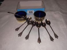 A pair of silver plate salts with blue glass liners & 6 boy scout spoons