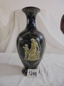 A Doulton Slaters patent 9.5" high vase with narrow neck. Dark blue with star patterns