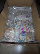 A large lot of bags of loose stamps.