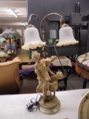A figural twin light table lamp on marble base, COLLECT ONLY.