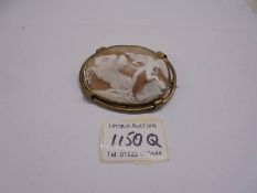 A superb quality carved cameo shell brooch with angel and horses.