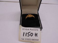 An 18ct gold ring size Q, 2.3 grams.