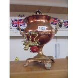 A Victorian copper samovar with brass tap.
