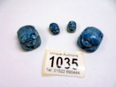 Four Egyptian turquoise scarab beetle seals/beads.