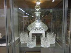 A good quality cut glass ship's decanter with a set of six cut glass whisky goblets. COLLECT ONLY.