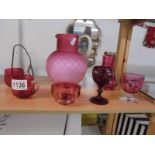 A pink satin glass jug and six items of cranberry glass.