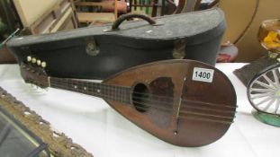 An old cased mandolin.