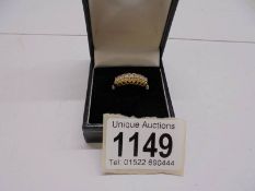 A 9ct gold ring set white stones (CZ), size P half, 2.8 grams.