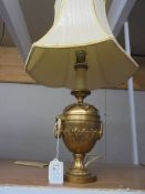 A good quality Adam style brass table lamp with shade.