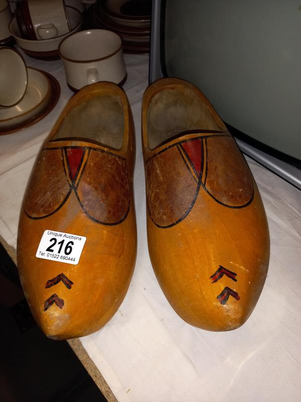 A pair of vintage wooden clogs