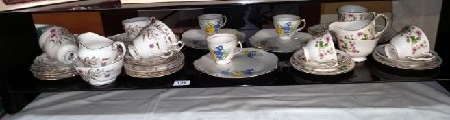 A quantity of bone china part tea sets including Paragon etc.