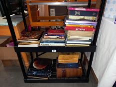 A good lot of miscellaneous books on 2 shelves