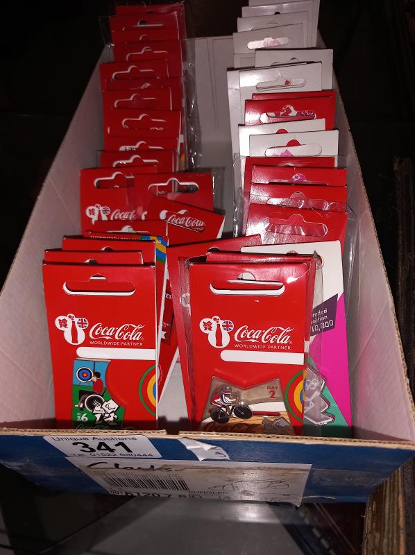A collection of Coca-Cola Olympic pins & other Olympic pins