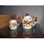 A fox and hounds teapot and milk jug