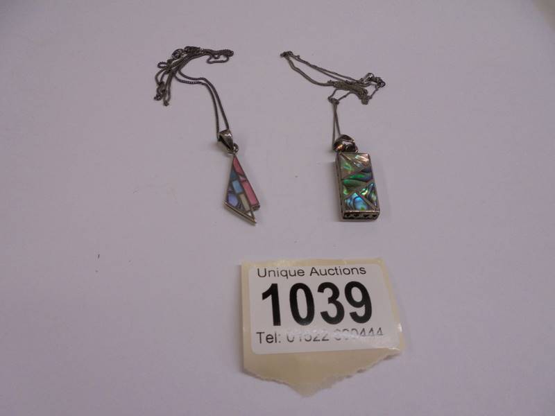 Two silver pendants, 10.3 grams.