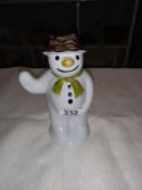 An unmarked pottery snowman money box 18cm high