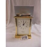 A good quality brass carriage clock by Woodford, Est. 1860 with key and boxed, in working order.