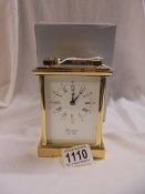 A good quality brass carriage clock by Woodford, Est. 1860 with key and boxed, in working order.