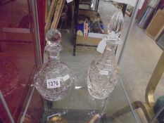 Two good quality cut glass decanters.