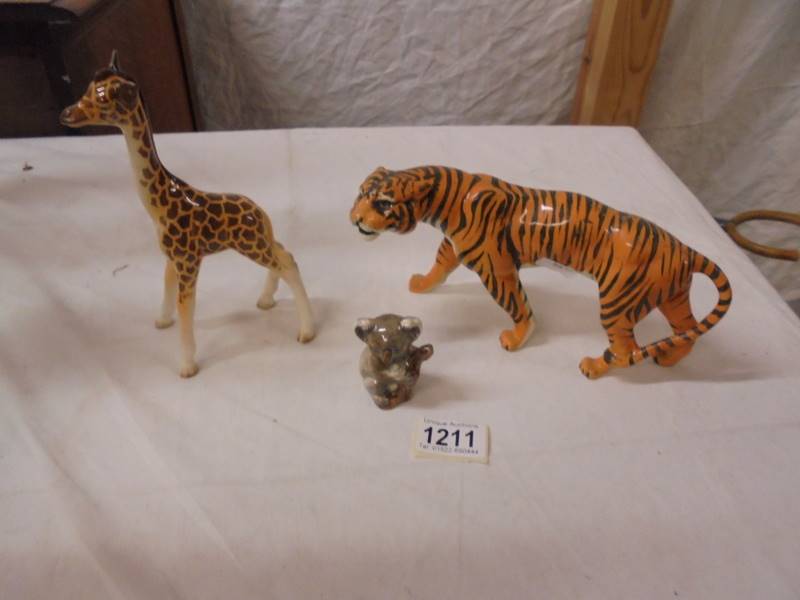 A Beswick tiger, giraffe and koala.