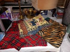 A quantity of tartan scarves & blankets