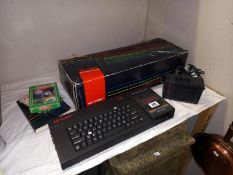 A boxed ZX Spectrum 3 & quantity of games