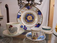 A Royal Worcester Millenium plate, a large Adams tea cup with saucer and two other cups with saucers