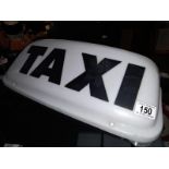 A 'Taxi' illuminated roof sign