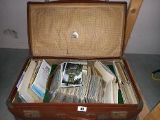 A case full of postcards and guide books etc