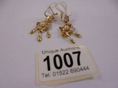 A pair of 18ct gold and pearl earrings, 4 grams.