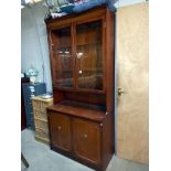 A mahogany dresser with inlaid panelled cornice and deep cut glazed doors