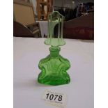 A green art deco glass scent bottle.