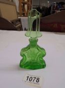 A green art deco glass scent bottle.