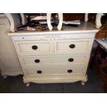 A good quality 2 over 2 white/cream chest of drawers