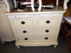 A good quality 2 over 2 white/cream chest of drawers