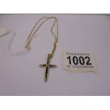A 9ct gold cross on chain, 3.3 grams.