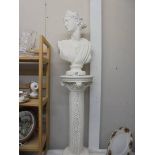 A Grecian style bust on a pedestal. COLLECT ONLY.