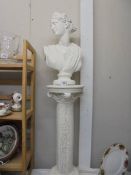 A Grecian style bust on a pedestal. COLLECT ONLY.
