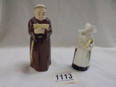 Two Royal Worcester candle snuffers - a monk and a nun.