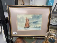 A framed and glazed watercolour seascape signed J Coldron.