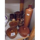 A mixed lot of stoneware bottles, lidded dishes etc.,