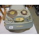A vintage reel to reel tape recorder.
