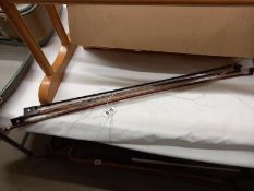 Two antique violin bows, 1 x 26 7/8 inches, 1 x 28 7/8 inches, no visible makers marks.