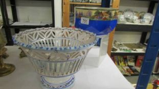 A fretwork fruit bowl and one other.