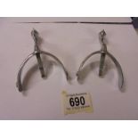 A pair of vintage chrome plated riding spurs.