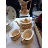 A Crown Ducal 5 piece tea set (small chip to teapot lid)